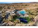 Aerial view showcasing community amenities, including a swimming pool, basketball court, and outdoor lounge areas at 12 Bloomfield Hills Dr, Henderson, NV 89052