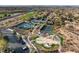 Aerial view of community amenities, including tennis courts and a playground, set among manicured landscaping at 12 Bloomfield Hills Dr, Henderson, NV 89052