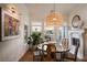 Dining room with wood table, chairs, and large windows at 12 Bloomfield Hills Dr, Henderson, NV 89052