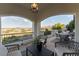 Covered patio with wicker furniture and scenic views at 12 Bloomfield Hills Dr, Henderson, NV 89052