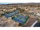 Aerial view of community tennis courts, highlighting the well-maintained green courts and surrounding landscape at 12 Bloomfield Hills Dr, Henderson, NV 89052