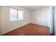 This bedroom has beautiful wood floors and a large sunny window at 1701 E Katie Ave # 65, Las Vegas, NV 89119