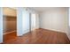 This is an empty bedroom with beautiful wood floors, a walk in closet, and ensuite bathroom at 1701 E Katie Ave # 65, Las Vegas, NV 89119