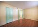 Bright bedroom with hardwood flooring and a large closet at 1701 E Katie Ave # 65, Las Vegas, NV 89119