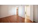 This is an empty bedroom with beautiful wood floors, a walk in closet, and ensuite bathroom at 1701 E Katie Ave # 65, Las Vegas, NV 89119