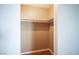 A spacious walk-in closet with shelving and rods for optimal storage at 1701 E Katie Ave # 65, Las Vegas, NV 89119