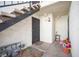Condo entrance featuring secure door, concrete stairs and walkway with rock landscaping at 1701 E Katie Ave # 65, Las Vegas, NV 89119