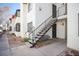 Building exterior featuring concrete staircase leading to the upper level and desert landscaping at 1701 E Katie Ave # 65, Las Vegas, NV 89119