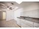 Eat-in kitchen with white cabinets, modern countertops, and stainless-steel appliances at 1701 E Katie Ave # 65, Las Vegas, NV 89119