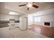 Open kitchen featuring white appliances, granite countertops, and a view into the living area at 1701 E Katie Ave # 65, Las Vegas, NV 89119