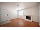 Living room featuring hardwood floors, fireplace and ample natural light at 1701 E Katie Ave # 65, Las Vegas, NV 89119
