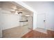 Living room featuring ceiling fan and open access to kitchen with white appliances at 1701 E Katie Ave # 65, Las Vegas, NV 89119