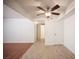 Open-concept living space with ceiling fan and tile flooring leading to hallway at 1701 E Katie Ave # 65, Las Vegas, NV 89119