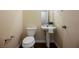 Clean bathroom with pedestal sink and toilet at 1859 Cypress Greens Ave, Henderson, NV 89012