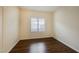 Bright bedroom with wood-look flooring and large window at 1859 Cypress Greens Ave, Henderson, NV 89012