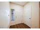 Bright entryway with wood-look flooring and white doors at 1859 Cypress Greens Ave, Henderson, NV 89012