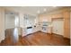 Open kitchen with light wood cabinets and white appliances at 1859 Cypress Greens Ave, Henderson, NV 89012