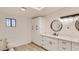 Updated bathroom with double vanity, new flooring, and a skylight at 1947 Balboa Ave, Las Vegas, NV 89169