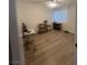 Spacious bedroom with wood-look floors and large window at 1947 Balboa Ave, Las Vegas, NV 89169