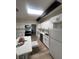 Modern kitchen with white cabinets, skylight, and island at 1947 Balboa Ave, Las Vegas, NV 89169