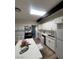 Modern kitchen with white cabinets, skylight, and island at 1947 Balboa Ave, Las Vegas, NV 89169