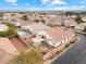 Aerial view of a single-story home with pool, patio, and tile roof in a suburban neighborhood at 2026 Dakota Lodge Ave, Las Vegas, NV 89123