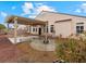 Covered patio and backyard area with desert landscaping, a pergola, and block wall surround at 2026 Dakota Lodge Ave, Las Vegas, NV 89123