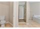 Bright bathroom with a walk-in shower, soaking tub, and toilet at 2026 Dakota Lodge Ave, Las Vegas, NV 89123