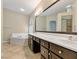 Bright bathroom featuring a soaking tub, double sink vanity, and walk-in shower at 2026 Dakota Lodge Ave, Las Vegas, NV 89123