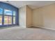 Bedroom featuring high ceilings, large windows, neutral carpet and natural light at 2026 Dakota Lodge Ave, Las Vegas, NV 89123