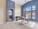 Dining room featuring high ceilings, large windows, neutral carpet and natural light at 2026 Dakota Lodge Ave, Las Vegas, NV 89123