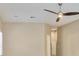 Bright room with neutral walls and carpet, complemented by a ceiling fan and natural light from window at 2026 Dakota Lodge Ave, Las Vegas, NV 89123