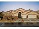 Charming single-story home with a gated courtyard, desert landscaping, and a two-car garage at 2026 Dakota Lodge Ave, Las Vegas, NV 89123