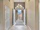 Inviting foyer with high ceilings, decorative chandelier, and view of the gated courtyard at 2026 Dakota Lodge Ave, Las Vegas, NV 89123