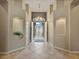 Open foyer with alcoves, tile flooring, chandelier lighting and a view of the front gate at 2026 Dakota Lodge Ave, Las Vegas, NV 89123