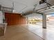 Spacious garage featuring epoxy floors, built-in storage cabinets and overhead racks for organization at 2026 Dakota Lodge Ave, Las Vegas, NV 89123