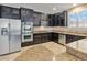 Modern kitchen with granite countertops, stainless steel appliances, and dark wood cabinetry at 2026 Dakota Lodge Ave, Las Vegas, NV 89123