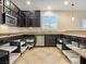 Spacious kitchen featuring dark cabinetry, stainless steel appliances and granite countertops at 2026 Dakota Lodge Ave, Las Vegas, NV 89123