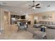 Open-concept living room featuring modern furnishings, neutral tones, and tile flooring at 2026 Dakota Lodge Ave, Las Vegas, NV 89123