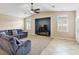 Cozy living room with neutral carpeting, built in media center and abundant natural light at 2026 Dakota Lodge Ave, Las Vegas, NV 89123