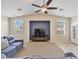 Cozy living room with neutral carpeting, built in media center and abundant natural light at 2026 Dakota Lodge Ave, Las Vegas, NV 89123