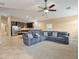 Open-concept living room featuring comfortable furnishings, neutral tones, and tile flooring at 2026 Dakota Lodge Ave, Las Vegas, NV 89123