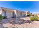 Home exterior showcasing a screened patio and yard at 2084 Tiger Links Dr, Henderson, NV 89012