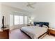 Main bedroom with king-size bed and bay window at 2084 Tiger Links Dr, Henderson, NV 89012