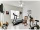 Home gym with treadmill, exercise bike, and rocking chair at 2084 Tiger Links Dr, Henderson, NV 89012