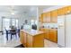 Kitchen with island, dining area, and view to backyard at 2084 Tiger Links Dr, Henderson, NV 89012