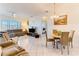 Open living room and dining area with tiled flooring at 2084 Tiger Links Dr, Henderson, NV 89012