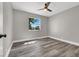 Spacious bedroom with gray walls, wood-look flooring, and a window at 209 N 21St St, Las Vegas, NV 89101