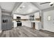 Modern kitchen featuring white shaker cabinets, stainless steel appliances, and grey vinyl flooring at 209 N 21St St, Las Vegas, NV 89101