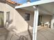 Enclosed patio featuring covered awning, and sliding door access to interior at 2119 Pebble Creek Ln, Laughlin, NV 89029